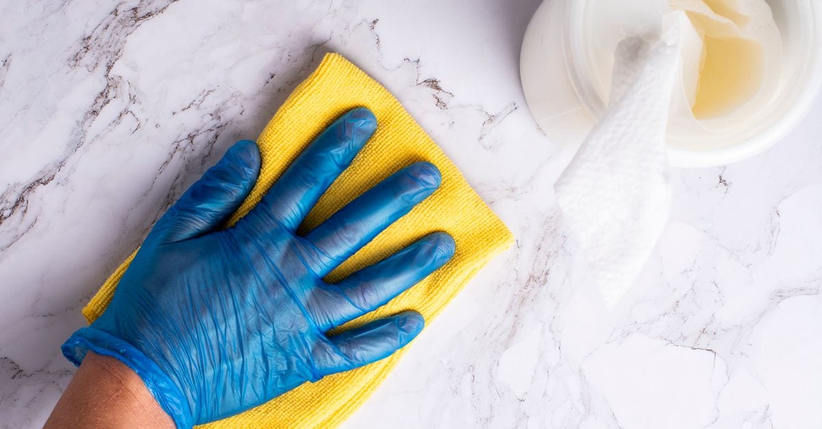 Cleaner maintaining a tidy kitchen in an Australian home
